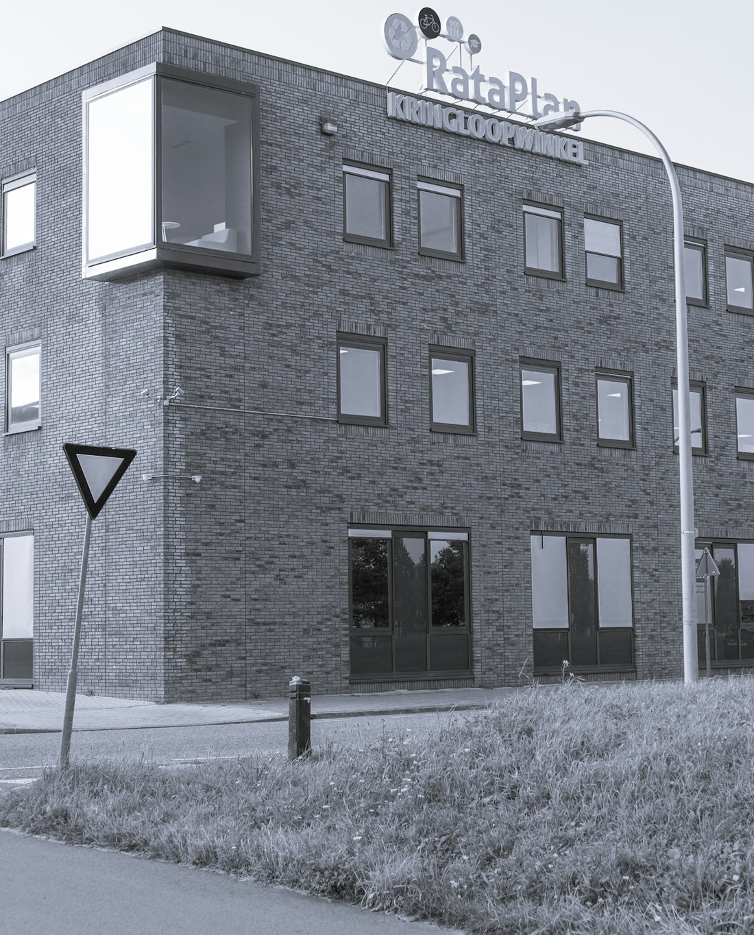 brown brick building with black door