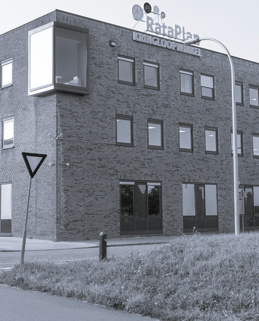 brown brick building with black door