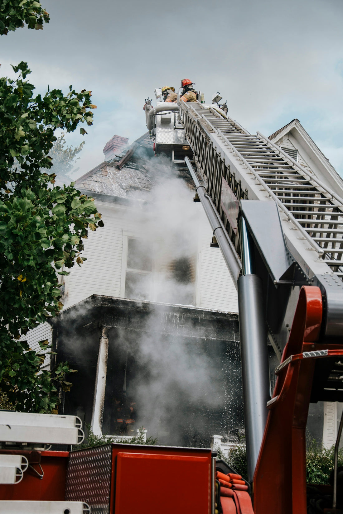 a firetruck with smoke coming out of the back of it