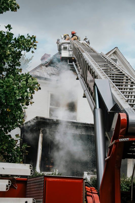 a firetruck with smoke coming out of the back of it