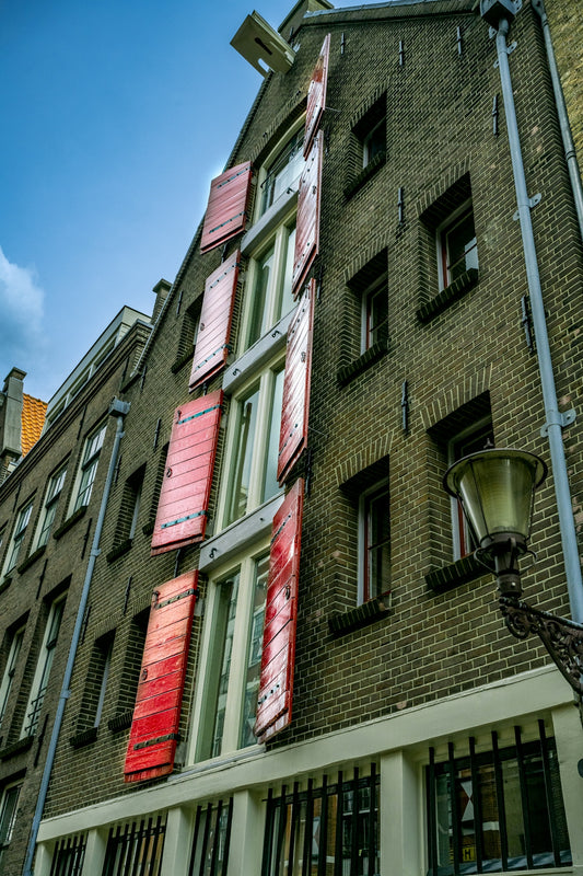 a building with windows and a lamp post