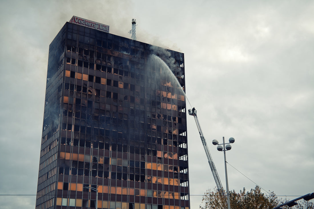 Skyscraper on fire with firefighters battling blaze