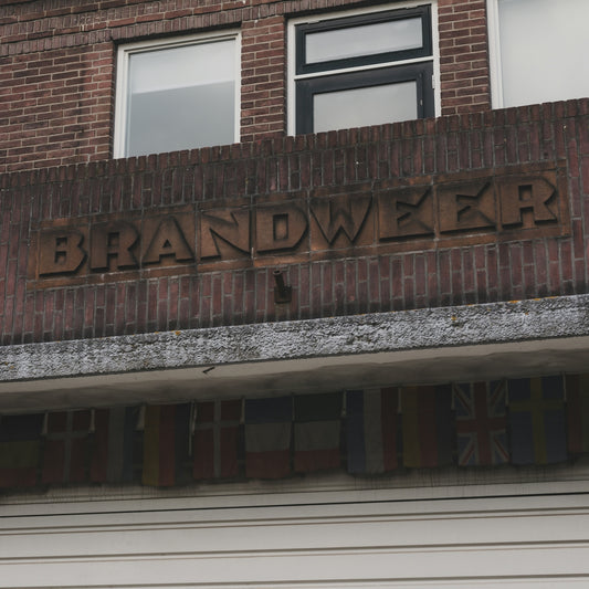 Brick building facade with brandweer sign